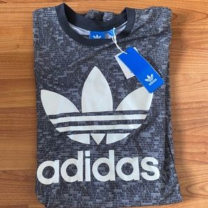 Gray, white, and black adidas logo tee.